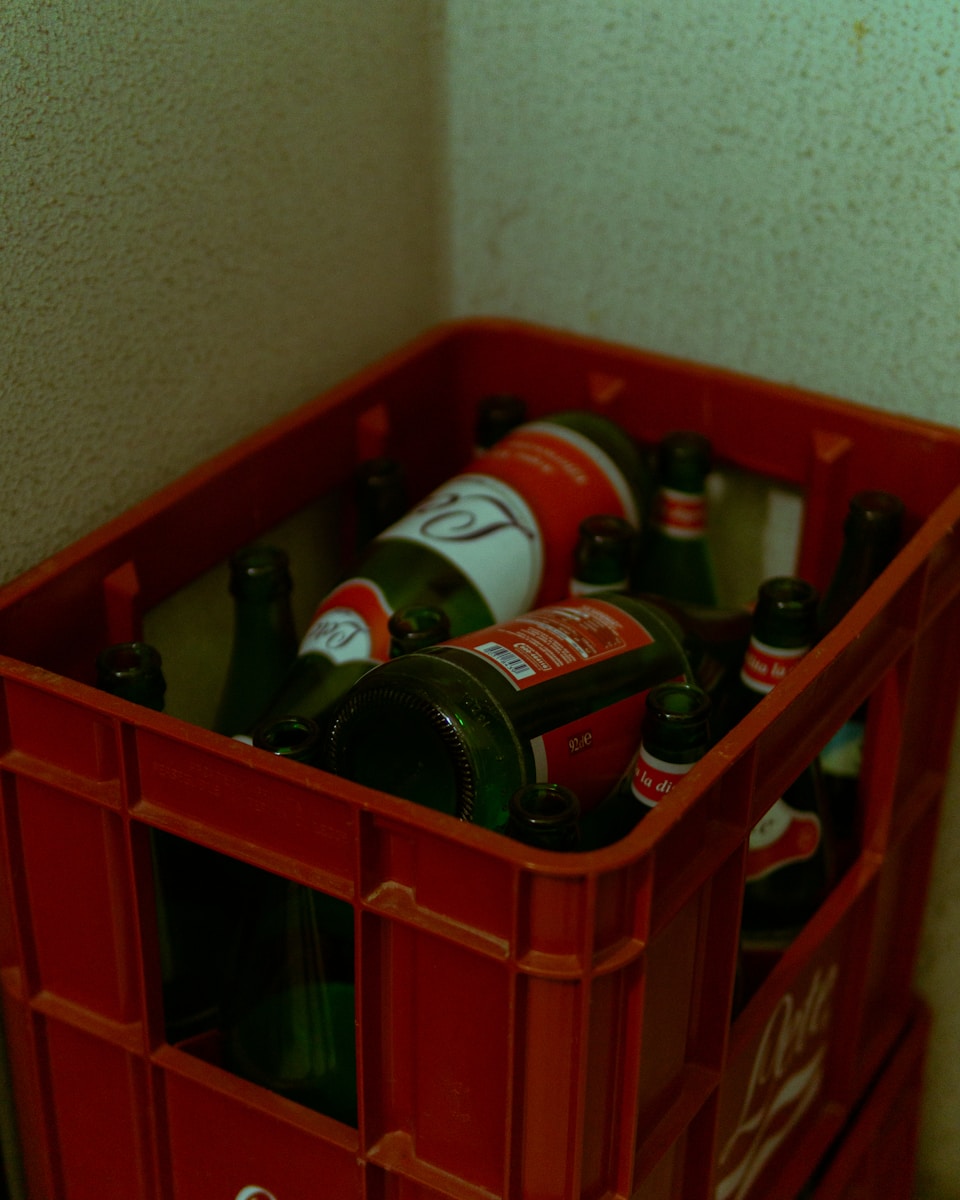 a shelf with bottles of alcohol on it