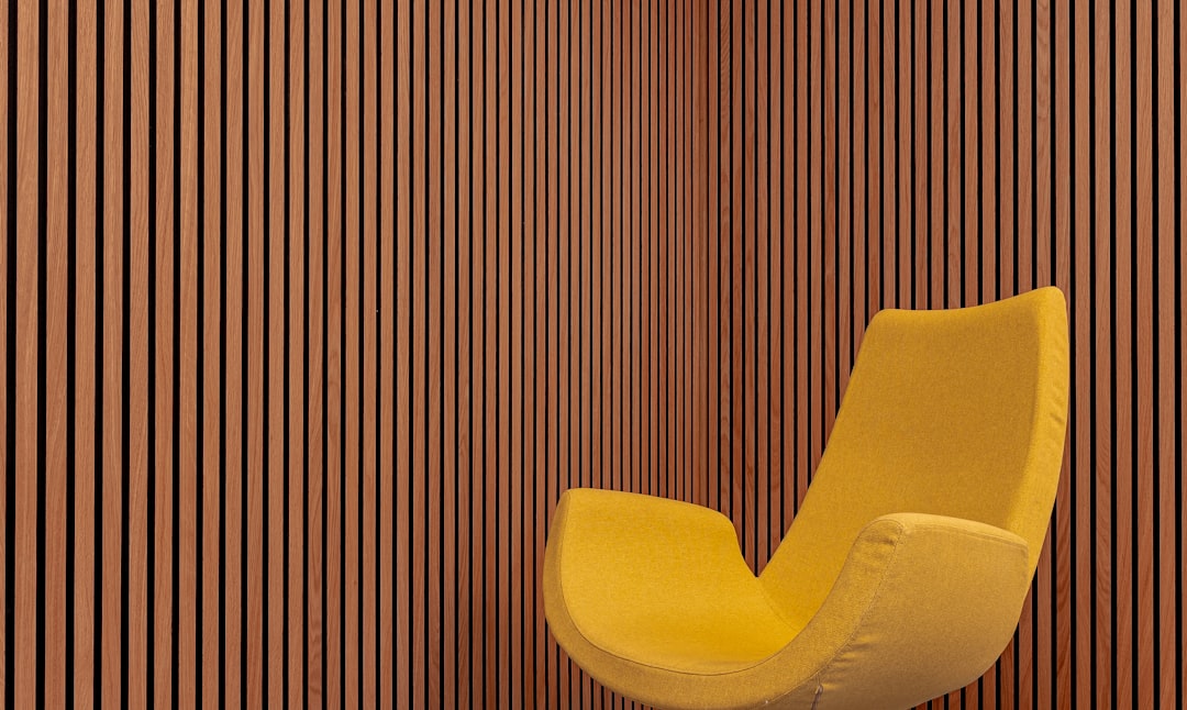 Wooden wall and modern armchair